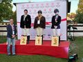 3 Liwia na podium po wręczeniu medali