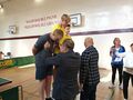 Dominik w trakcie wręczenia medalu za drugie miejsce w turnieju wojewódzkim w tenisa stołowego. 