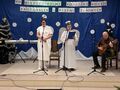 17. uczestnicy konkursu wykonują utwór na scenie w tle napis XVII Międzyszkolny Konkurs Kolęd Pastorałek i Pieśni Zimowych