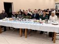 2.jury konkursu kolęd siedzi przy stole na sali
